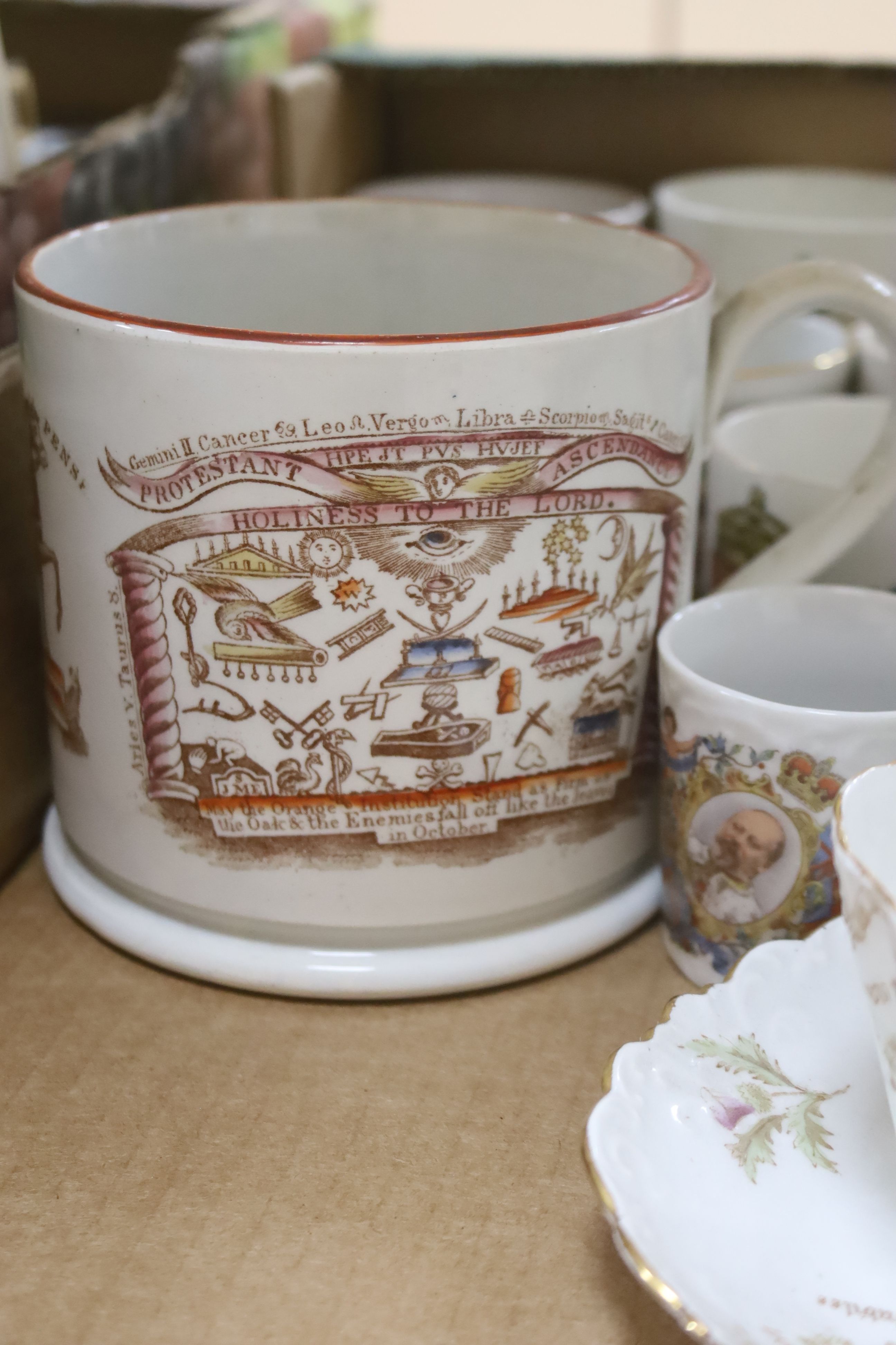 A collection of commemorative ceramics, including a pearlware Orangemen mug dedicated to William III, 11.5cm high